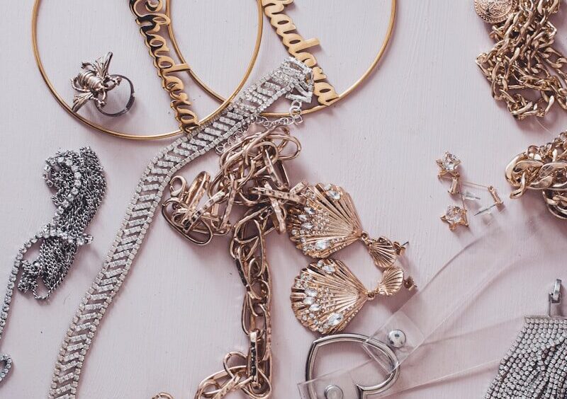 A collection of gold and silver jewelry including necklaces, earrings, and rings